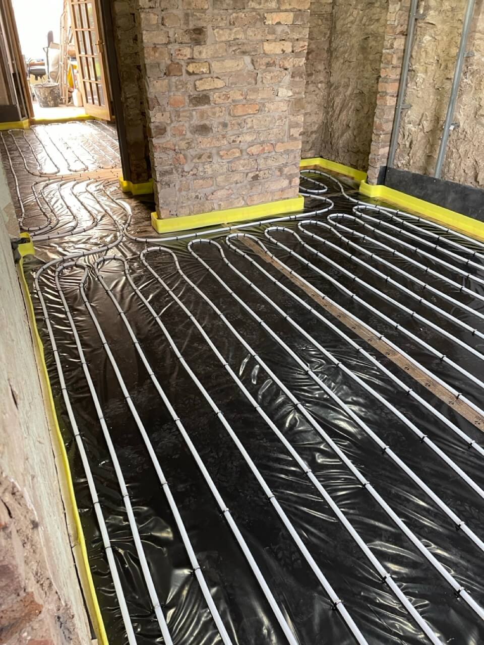 a full renovation of a domestic property, installing underfloor heating, new heating system, new kitchen and bathroom, building a new bespoke staircase installing new doors as well as plastering and decorating